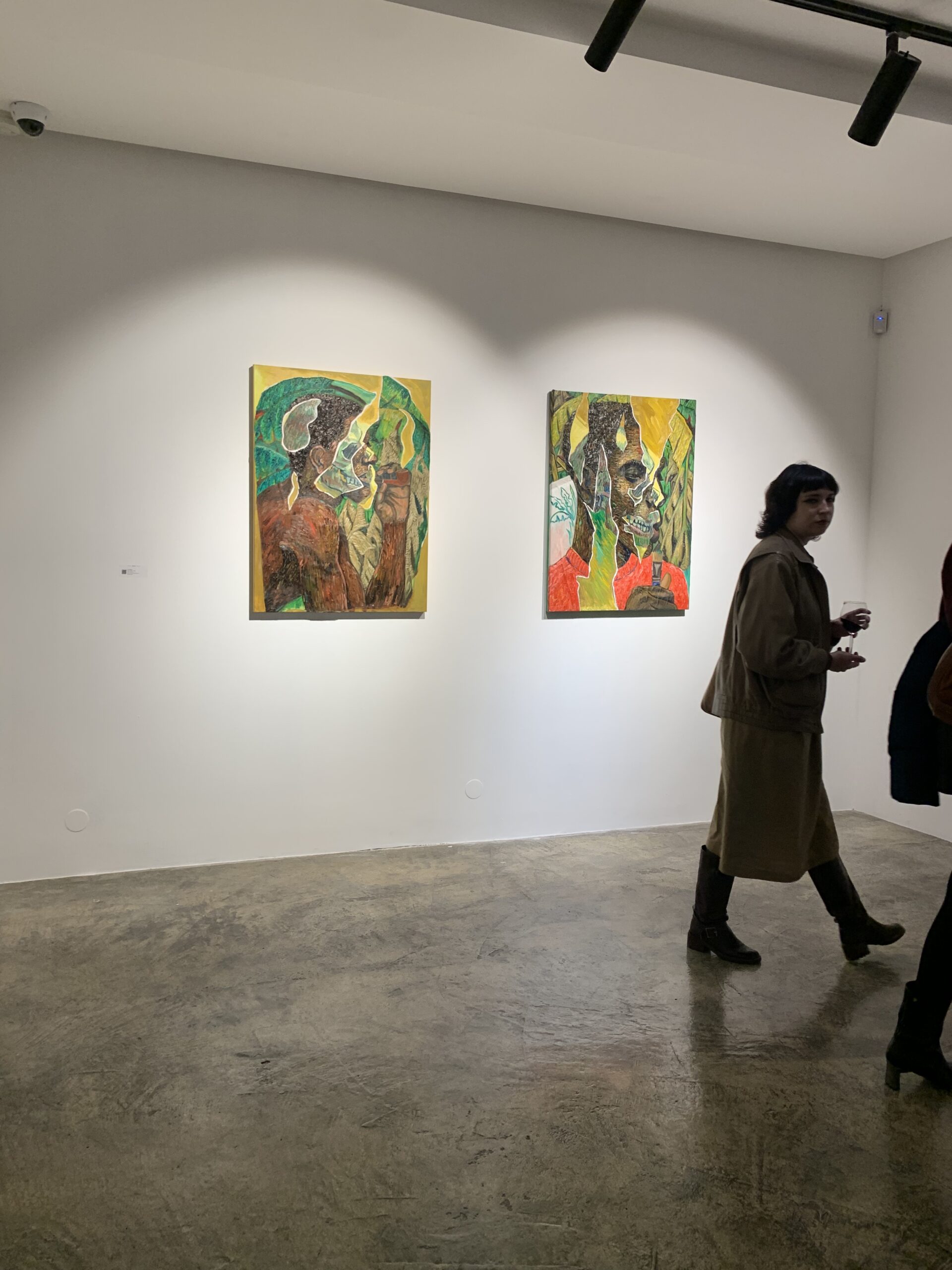 two cubist portraits on wall