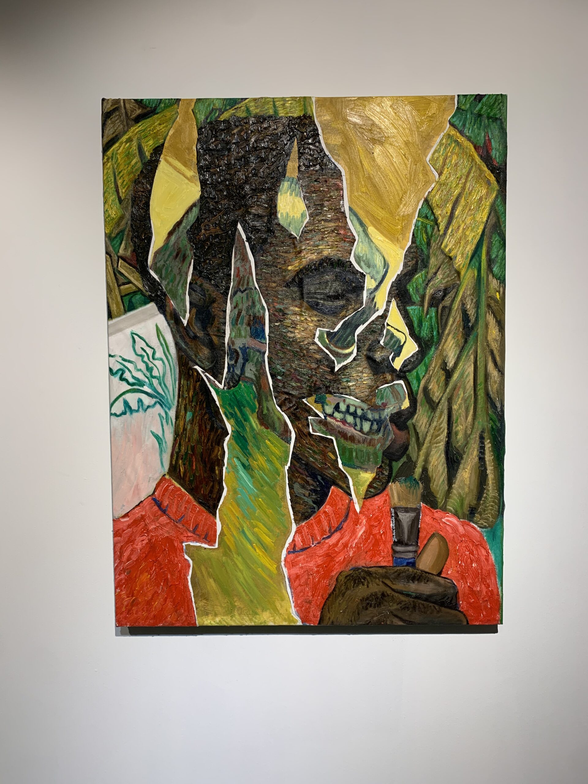 two cubist portraits on wall